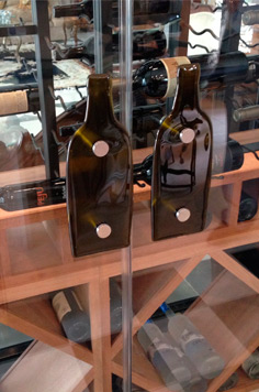 custom door handle, glass door, red wine, custom wood work, wine bottle, aabc wine cellar, detail, stacked wine bottle, craftsmanship, collection