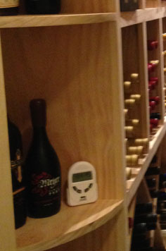 thermostat, wood work, red wine, custom wood work, wine bottle, aabc wine cellar, detail, stacked wine bottle, craftsmanship, collection