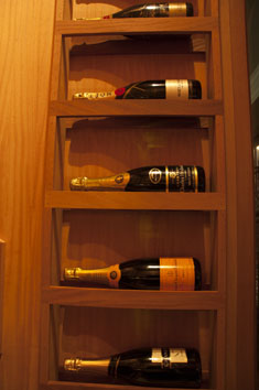 five bottles, champagne, wood work, vintage champagne, expensive champagne, collector, champage storage, aabc, houston, custom storage