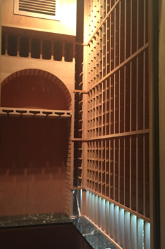 small wine cellar inside a walkin closet
